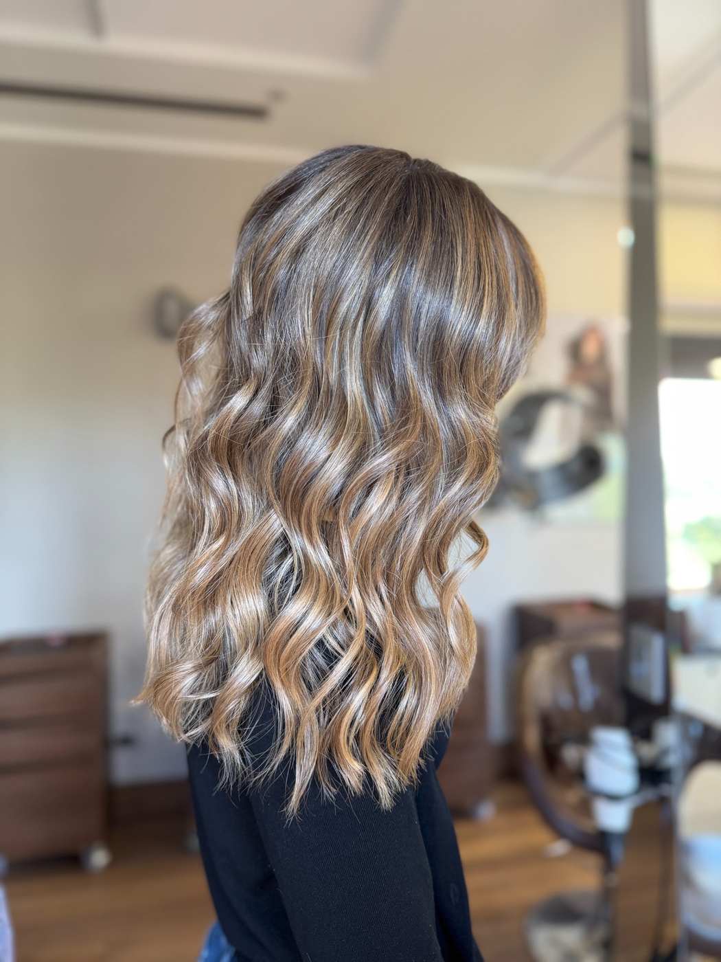 Degradè con schiariture dorate su capelli castani